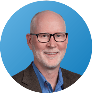 Gregg Headshot_Webinar_Blue background (1)